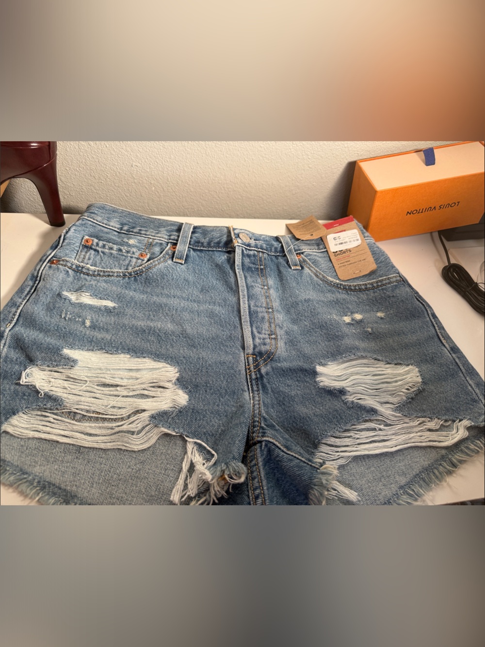 High-Waist Distressed Denim Shorts in Light Blue